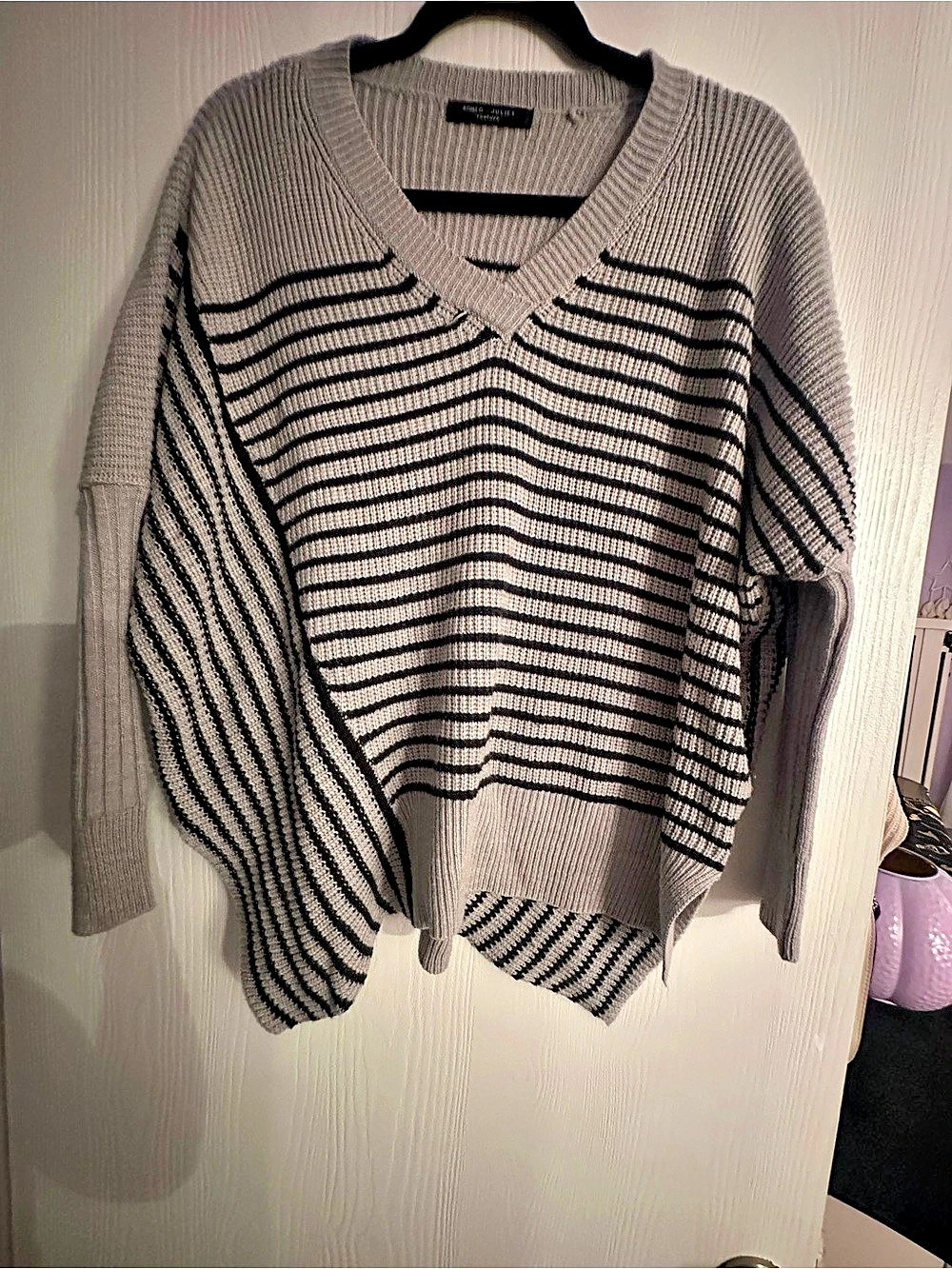 Romeo & Juliet Couture Striped V-Neck Asymmetrical Sweater in Gray & Black